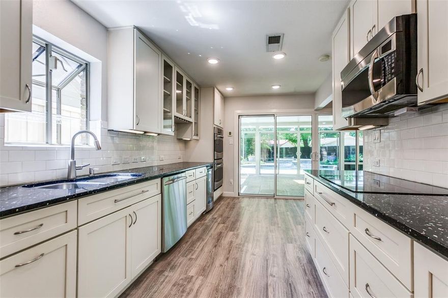 Welcome to this beautifully updated home in Spring Creek! Upgrades to kitchen & baths as well as paint & flooring! Living room was transformed into a gorgeous library with California Closet cabinetry with showcase lighting for visual effect! Family room with 2-sided fireplace! Solarium has walls of glass to bring the gorgeous pool area into view! Kitchen has white painted Kraft Maid cabinets & cool Ecoglass counters! Pull out pantry shelving! GE Profile stainless appliances! Gorgeous saltwater pool & spa with firepit for extra fun! Gated driveway has electric gate! Rear entry garage with door openers, sprinkler system for the yard & a tankless water heater! Updated windows throughout! Primary bedroom has wall mounted fireplace & 2 sets of barn doors for bath &closet! Updated ensuite bath has gorgeous stand up shower, deep soaking tub & two vanities & two sinks! California Closet system with wall mounted mirror makes getting ready easy & fun! Zoned heat & air with updated thermostats!  Refrigerator, washer & dryer can stay!