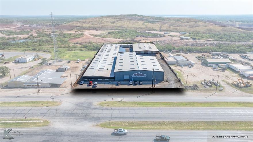 Exceptional Location for this high-quality Warehouse-Office Building just north of Abilene and the new Lancium Data Center on Hwy 277. There are 4 buildings total which make up 64,079 sf of Insulated Warehouse space and 2,213 sf Class A Office Space. The 2.77 acre site allows for dock high access as well as ground level service doors and is located on the access road of US Hwy 277 North approximately 3.5 miles north of Interstate 20.

All of the buildings are constructed of pre-engineered metal panels over steel I-Beam Frames with galvanized steel roof panels, all resting on a reinforced concrete foundation. There was a full roof overlay in 2025 with IB PVC along with new trim, gutters, and skylights throughout. All of the buildings have vinyl backed insulation on the walls & ceilings. There are numerous manually operated overhead doors in the buildings and the large building is dock high with 2 overhead cranes spanning the length of the building (5 & 10 Ton). Two of the dock high spaces are covered by the building structure. Eave heights range from 12’ to 27’.

Site Improvements include asphalt paved yard areas, concrete paved parking area along the frontage road, 6’ chain link perimeter fence, and exterior building mounted security lights. All utilities are to the facility including natural gas. There is currently not a survey of the property.