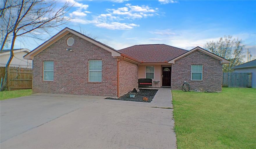 This beautifully maintained 3 Bedroom, 2 Bath brick home in Mineral Wells Texas is a perfect blend of comfort, functionality, and convenience.
Step inside to a bright, open living area featuring vaulted ceilings that create a spacious airy feel with a kitchen featuring ample counter space and storage with stainless steel appliances, a separate dining area with a tray ceiling, and a laundry room conveniently located right off of the kitchen. 
This home features a split floor plan with the master suite on one side of the home and the two additional bedrooms on the opposite side, offering privacy and separation for family members and guests. There is also a large bonus room ideal for a second living area, game room, home office, extra bedroom, or a flex space to fit your lifestyle.
This property offers a detached garage with rear street access as well as double off street parking in the front driveway for easy everyday convenience. Additionally you can enjoy outdoor living with a covered front and back porch, and plenty of privacy in the fully fenced back yard, perfect for kids, pets, and gatherings.
This move in ready home is ideally located between Lamar Elementary and the Mineral Wells Junior High with quick and easy access to shopping, dining, parks, downtown, and all that Mineral Wells has to offer.