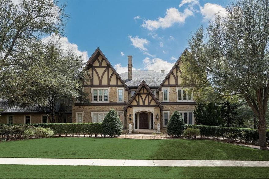 Exquisite Craftsmanship and elegant execution pervade this elegant estate sited along serpentine St. Johns Drive and Hackberry Creek in Old Highland Park, First Installment. The final work of master Classicist Cole Smith, Smith-Ekblad & Assoc., build by Crowbar Constructors, Cole Smith, Jr. with design consultation by Sherry Hayslip Interiors, the house exudes stately elegance. Site lines & floor plan take advantage of verdant park & trails. Exquisite craftsmanship throughout with commercial grade structure. Multiple living areas, dining areas, food preparation kitchen, levels, bedrooms, outdoor spaces culminate into a magnificent experience. The Great Room, two stories high, anchors the house, with brilliantly engineered acoustics and handsome master crafted carpentry; it opens to a picturesque screened porch with fireplace and views to the park. It is complimented by a beautiful formal Dining Room, surveying the rear grounds of this rare acre lot. Privacy is ultimately afforded by the corner lot. Kitchen, Breakfast Rm, Conservatory and upstairs Primary share the view. The first floor is completed by the Fitness Rm, a near Olympic sized Natatorium with cabana area and a Guest Apartment along the north front. Fitness and Guest have private north entrances. Commercial elevator serves all 4 floors. The Primary consists of bed chambers, living area and Gentleman's study. Study opens to the upstairs screened balcony, also overlooking the greenbelt and park. The primary bath features an expansive multiple head shower with body sprays, a separate garden tub, dual sinks, a vanity desk & 2 water closets. The couture closet with rows of wardrobes and glass front curio cabinets adjoins a haberdasher's dream, accounting for a luxurious experience; in the closet a circuitously situated private elevator accesses oversized pool perfect for swim or recreation & cabana from the primary. 4 additional ensuite bedrms, secondary laundry station, loft & rear stairwell finish the floor.