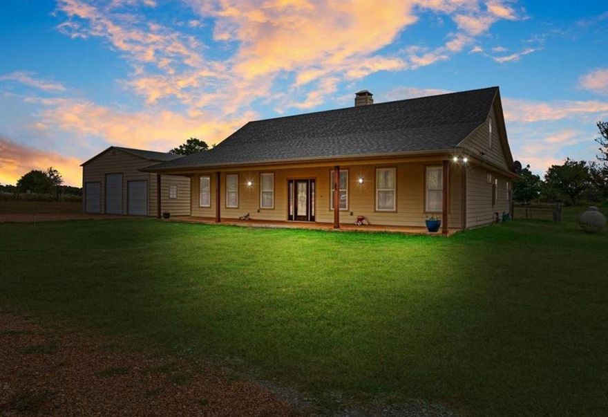 Presenting 7944 CR 669, Blue Ridge, TX USA. the perfect combination of a modern Texas farmhouse, on 5.24 acres, with NO Deed Restrictions, complete with a 30x30 workshop and a big tank. Location is important and you are positioned in Blue Ridge ISD, between Farmersville and Blue Ridge, close to State Highway 78, and an easy commute into the Sherman technology corridor, McKinney or DFW. Step inside to the expansive vaulted ceilings, showcasing wood rafters and a central brick fireplace. Yes, it's hot outside today, but you will appreciate the easy to use gas fireplace come winter. Turn the corner and relax in the massive primary bedroom, complete with an ensuite bathroom, offering a whirlpool tub, dual copper sinks and a walk-in custom shower. The kitchen showcases a copper farm sink, generous cabinets, wood counters and a gas stove. The second bedroom is a suite with access to the adjacent bathroom. Since the home is one and a half stories, you can escape upstairs to the secluded third bedroom. You will appreciate the spray foam insulated walls, a tankless hot water system and an attic with wood floors for extra storage. The recently built 30x30 workshop, on a concrete pad, with roll-up doors, is ready for your truck, tractor and side-by-side. Step outside onto the oversized front and back porches, enjoy the cooking shed and fenced backyard. The picture- perfect land is perimeter fenced on three sides, and boasts a nearly half acre stocked pond. So, bring your fishing pole. Your cows will love it here. You don't have a cow, well, maybe you need one.  NO Deed Restrictions. NO Floodplain. The desirable Wilson Clay and Crocket Soils are rated for grazing through limited farming. Information is deemed reliable but Buyer should perform due diligence.