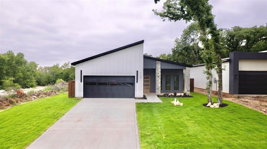 This brand new modern home, tucked away at the end of a quiet dead-end street, features 10 foot ceilings, exceptional privacy and peaceful surroundings. With no neighbors behind or to the left, the property backs up to the natural beauty of the Trinity River, creating a relaxing and private setting.
This thoughtfully designed 3 bedroom, 2 bath home features a bright open concept layout with modern finishes throughout. The kitchen showcases quartz countertops, custom cabinetry, and a spacious island overlooking the living and dining areas. Large windows fill the home with natural light while offering views of the fully fenced backyard and surrounding nature.
Conveniently located just minutes from Highway 175 and Interstate 20, the home provides quick access to shopping, dining, and commuting while still feeling private and tucked away.