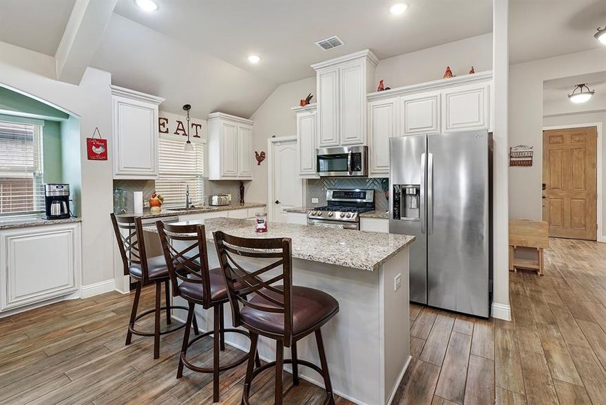 Use of Preferred  Lender will offer to pay .75 points of buyer’s closing costs. Call TODAY to see if you Qualify!
Welcome to your dream home! This stunning 4-bedroom, 3-bath residence offers a perfect blend of comfort and elegance, complete with a dedicated office and a cozy second living room and solar panels! As you step through the inviting foyer adorned with trey ceilings, you’ll immediately appreciate the seamless flow of wood-like tile throughout the first floor, creating an easy-to-maintain and stylish environment.The home office, strategically located at the front, is bathed in natural light, making it an ideal space for productivity. Retreat to the spacious master suite, tucked away for privacy, featuring dual sinks, a luxurious tiled walk-in shower, and a soaking tub—perfect for unwinding after a long day.The open-concept design of the kitchen, dining, and living areas makes entertaining a delight. Revel in the beauty of custom cabinets, exquisite granite countertops, and a built-in serving buffet with ample storage. The kitchen island, complete with additional seating, is perfect for casual meals or gatherings, while large beams elegantly tie the spaces together, enhancing the overall aesthetic.Two generously sized bedrooms and a second full bathroom round out the first floor, alongside a built-in desk that serves as a versatile office space, charging station, or craft area. Upstairs, discover your second living room—ideal for a play area, media room, or game room—along with the fourth bedroom and full bath for added convenience.Step outside to your private sanctuary, featuring a 20-foot extended cedar back patio, complete with an Oklahoma flagstone wood-burning fireplace. Whether you're hosting a movie night or a game watch party, this outdoor space is designed for entertaining and relaxation.This home truly has it all—style, functionality, and a welcoming atmosphere. Don’t miss your chance to make it yours!