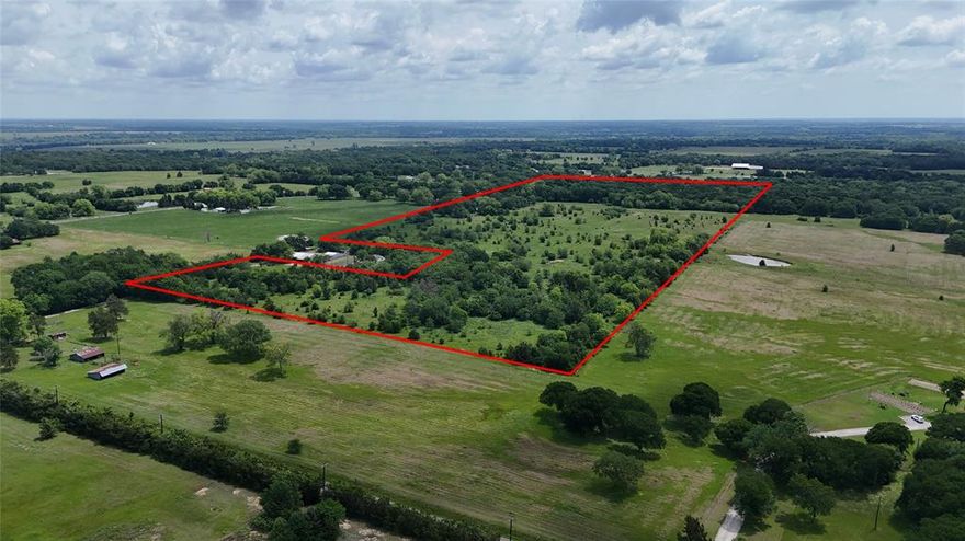 This beautiful farm has not been offered on the market since 1902, 50.33 acres ready for your dream home, barn, secluded arena and livestock.  Not many larger tracts of land left in the area and this beautiful farm boasts 10-15 acres of shade trees, 2 half to three quarter acre ponds with additional shade tree groves on this ranch would allow you to cross fence and transfer cattle pastures, or separate livestock.  Seclusion, massive hardwood trees, dual ponds and varying pasture lands make this an ideal location for your dream home or investment!  If you are in the market for a beautiful ranch minutes from Downtown Denison, retail dining, Medical, Austin College, Grayson College, and the new IT hub in Sherman, this could be the location for you!  50 minutes down hwy 75 to the DFW metroplex, 20 minutes to all night gaming and fun at Choctaw Casino across the river in Durant, OK.   Barb wire fences, most just a couple of years old, tenant is running cattle currently, would be happy to stay to keep your ag exemption or vacate within 60 days of closing.  

New entry could be made on the corner where my sign is as you come in and eliminate the need to drive past the two homes adjoining the ranch. 
Tenant is running cattle, do NOT enter property without appointment thru selling AGENT.