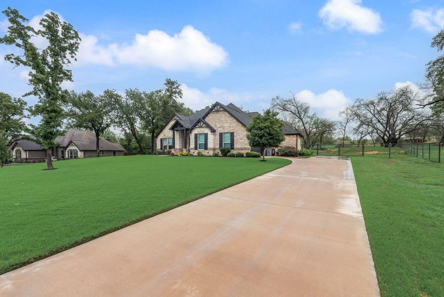 Motivated Sellers! This immaculate custom-built home sits on a beautifully landscaped 1-acre lot, surrounded by mature trees and backing to open pasture—offering privacy and peaceful country living with no neighbors behind.

Featuring 3 bedrooms, 2 full bathrooms, and a versatile office that can serve as a 4th bedroom, this home is designed with both comfort and style in mind. The open-concept living and kitchen area is highlighted by soaring vaulted ceilings with exposed wood beams, creating a warm and inviting atmosphere. The entryway showcases custom ceiling details, while the primary suite features elegant tray ceilings with decorative lighting.

The spa-like primary bathroom is a true retreat, complete with a garden tub, oversized walk-in shower with rainfall showerhead, and dual granite vanities. You’ll love the convenience of the spacious walk-in laundry room, which connects directly to the primary closet. The utility room also includes an additional water line for a second refrigerator.

The kitchen is built to impress, featuring granite countertops throughout, a large island with farmhouse sink, stainless steel appliances, and a walk-in pantry—all with beautiful views of the backyard’s mature oak trees.

Step outside to enjoy the covered patio, perfect for entertaining or relaxing while taking in the serene surroundings. Located in Scenic Wood Estates, this property offers a quiet, established country setting with no HOA and scenic walking areas.

Just a short 10 min drive to downtown Azle

Bonus: Refrigerator conveys with the home!