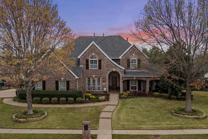 Step inside this breathtaking two-story traditional home with a pool, perfectly situated on a half-acre lot in the highly sought-after community of Sanctuary. A grand foyer with soaring 19-foot ceilings and sweeping hardwood floors welcomes you into this elegant yet functional home, where formal living and dining rooms are beautifully positioned off the entry. The home opens to an inviting entertainment space featuring a spacious family room with a cozy gas fireplace and large windows overlooking the serene outdoor oasis. The gourmet kitchen is a chef’s dream, complete with granite countertops, a gas cooktop, dual ovens, under-cabinet lighting, abundant prep space, and a large walk-in pantry. The serene primary suite is thoughtfully located on the main floor and offers dual walk-in closets along with a luxurious ensuite bath featuring separate vanities, a relaxing jetted tub, and a separate shower. A secondary bedroom with a walk-in closet and patio access is also on the main floor, making it ideal for a nursery or home office. A stunning wrought-iron split staircase leads to the second floor, where you’ll find a spacious game room, a media room with two-tiered seating, and three additional bedrooms—each with walk-in closets and private ensuite baths. Step outside to your backyard paradise with a firepit, where a sparkling heated saltwater pool with a tranquil waterfall feature and built-in table creates the perfect retreat. A covered pergola with a grill provides the ideal space for entertaining, while the expansive lawn offers plenty of room for kids and pets to play. Once you arrive, you may never want to leave.