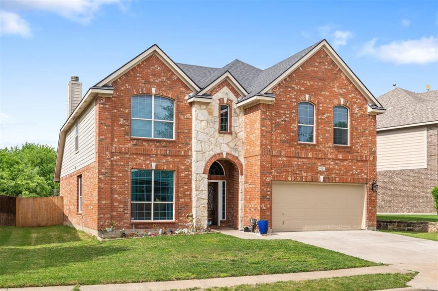 Soaring Spaces & Scenic Living in Marine Creek Ranch! Welcome to this beautifully designed two-story home with striking brick and stone curb appeal, where space, light, and lifestyle come together in the highly desirable Marine Creek Ranch community. Step through the inviting foyer and immediately feel the openness, highlighted by soaring vaulted ceilings, abundant natural light, and gorgeous hardwood floors throughout the main level. Just off the entry, a private home office offers the perfect work-from-home setup. The heart of the home is made for gathering—an impressive two-story living room with a gas fireplace flows seamlessly into the open kitchen and breakfast area. The chef’s kitchen features a gas range, prep island, new dishwasher, and extensive cabinetry and counter space, making it as functional as it is welcoming. The primary suite on the main floor provides a peaceful retreat with vaulted ceilings and a spacious en suite bath complete with dual sinks, a garden tub, separate shower, and a large walk-in closet. Additional first-floor spaces include a breakfast area and a flexible dining or sitting room to suit your lifestyle. Upstairs, the home truly opens up with a second living area or game room, a dedicated media room, and three generously sized bedrooms with oversized closets—perfect for family, guests, or hobbies. Step outside to a covered back patio overlooking a fully fenced yard that backs to natural green space, offering added privacy and a serene backdrop for outdoor entertaining or quiet evenings. Enjoy the best of community living with access to resort-style amenities including a pool, walking trails, fishing dock, and picnic areas—all just moments from your door. This home delivers the space you need and the lifestyle you’ve been looking for. Schedule your private showing today and experience Marine Creek Ranch living at its finest!