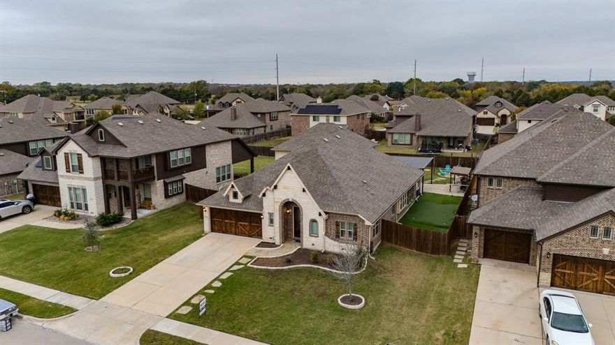 This stunning 4-bedroom, 3-bathroom two-story home is packed with upgrades! Inside, you’ll find a separate dining room, a 4th bedroom that can be converted into a game room, and a chef’s kitchen featuring a large island and walk-in pantry. The garage is fully equipped with epoxy flooring and its own HVAC system, perfect for year-round use. The upgraded backyard is a true retreat, boasting a built-in fire pit with surrounding light, an extended patio, a putting green, a built-in brick ice bin for entertaining, and a covered grilling area and a metal framed balcony deck ready for you to finish out to your exact specs. This home is move-in ready and designed for both comfort and entertainment. Schedule your tour today!