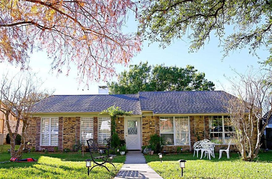 Beautifully Maintained Garland Home with Charming Curb Appeal & Oversized Covered Patio

Welcome to this warm and inviting single-story home featuring classic brick exterior, mature shade trees, and a beautifully manicured front yard that instantly feels welcoming. Inside, large front windows and plantation-style shutters bring in abundant natural light, creating a bright and comfortable living atmosphere.

Step outside to an impressive oversized covered patio, perfect for relaxing, outdoor dining, or year-round entertaining. The spacious deck includes lattice trim, ample seating space, and a bar-style counter area—an ideal setup for gatherings. The backyard also features a generous concrete area, storage space beneath the deck, and plenty of room for gardening or outdoor hobbies.

Additional highlights include:
• New flooring installed in March 2024
• New kitchen cabinets installed in March 2024
• New 8-ft cedar wood fence added in April 2024
• Interior painting completed in April 2024
• New water heater installed in November 2025
• Sprinkler system updated in August 2025
• Great curb appeal with a well-kept lawn and walkway lighting
• Mature trees providing shade and character
• Large back patio structure with durable roofing
• Private high fenced yard
• Flexible outdoor areas for entertaining, grilling, or storage

This home offers comfort, functionality, and a great outdoor lifestyle in a quiet, established Garland neighborhood. A must-see for buyers looking for a well-cared-for property with exceptional outdoor living space!