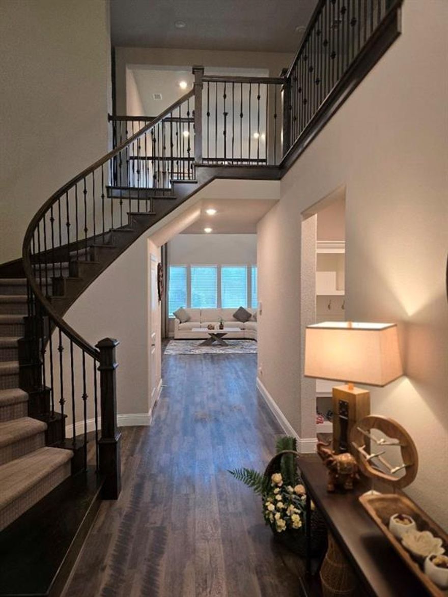 Welcome to your next home in the prestigious Auburn Hills community in McKinney—zoned to the top-rated Prosper ISD! This beautiful home features hardwood floors, open floor plan, SS appliances, including Refrigerator, gas cooktop, Double Oven.  The kitchen features a grand island, abundant cabinet storage, and a spacious walk-in pantry, providing both style and functionality. A separate formal dining room seamlessly connects to the kitchen, while the spacious living room with a cozy fireplace overlooks the peaceful backyard. Elegant and spacious primary bedroom has the ensuite bathroom separate walk-in shower and tub. Upstairs is the perfect layout with large game room and 3 other nice size secondary bedrooms. Outside a covered patio is perfect for gatherings. Backyard has plenty of space for outdoor dining or game night. Amenities are neighborhood pool, walking paths and playgrounds. Shopping, dining and entertainment are close by including theaters, Costco, and a huge selection of restaurants.  **Bonus: Landlord will provide a refrigerator, washer, and dryer for added convenience!.**