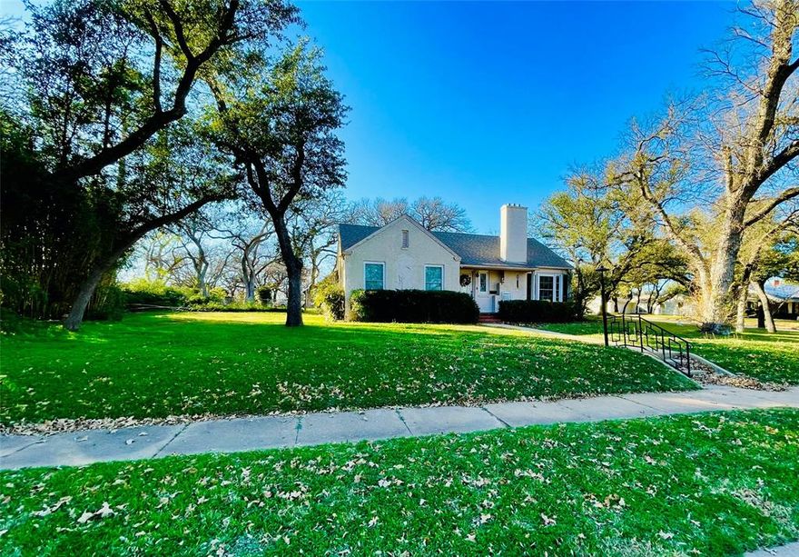 This house has been one of my favorites in Eastland since I was a kid!! The home with an old country cottage vibe on a huge corner lot of almost half an acre in a beautiful neighborhood is just bursting with charm and character. 3 bed 2 bath 2 living areas 1906 sq ft remodeled just a few years ago with new windows, foundation repair, new plumbing, updated electrical, new cabinetry, granite counter tops, pretty and unique tile work, high quality appliances, modern fixtures, gorgeous electric fire place, and beautiful updates through out the entire house. The yard is full of mature trees, lovely views and tranquility and has a 2 car garage, 2 storage buildings and a massive carport for your trucks or an RV. So much to love in this home and property and I can not wait to show you!!!
