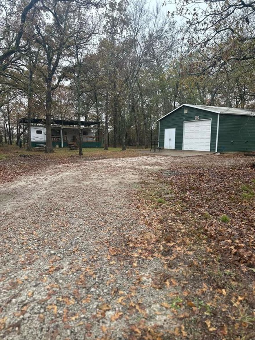 You have to come check out this awesome lot! It already has a great shop on it, with a concrete floor and a roll-up door! There is also an RV there, and all the utilities are in place as well!! You can keep that or stay there and build. Lake Fork is close, and there is lots to do in and around the area, with Quitman, Mineola, Emory, and Alba close in proximity to this lot!  The shop is 24' by 30' and the RV is 29'. Everthing stays in the RV including the dishes and other items left in the kitchen  There is also shelving in the shop and a refridgerator out there that stays.