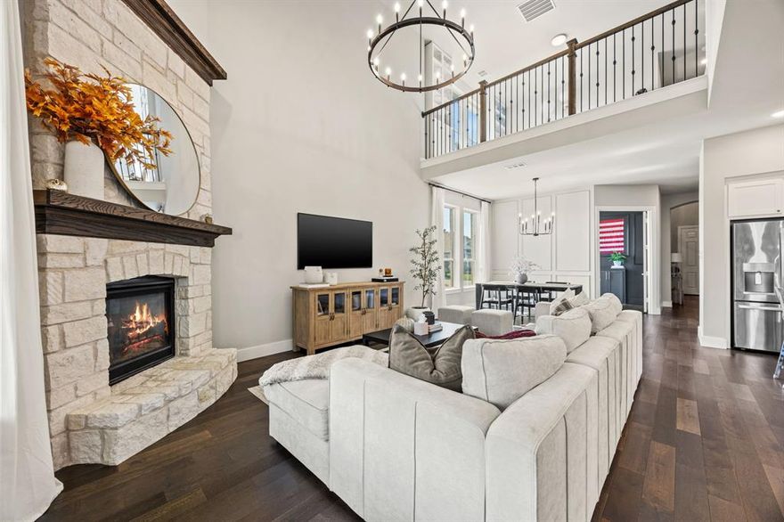 Discover the perfect balance of elegance and comfort in this stunning 4 bedroom, 4 FULL bath residence, which includes a downstairs office and upstairs gym, nestled in a growing part of McKinney! Situated on a premier corner lot, this home sets a new standard for luxury living with its thoughtful design and modern amenities. An oversized 2 car garage completes this home, offering ample parking and additional storage space. Step inside to be greeted by engineered hardwood floors that grace the entirety of the main living spaces, adding beauty and durability. The open-concept layout effortlessly combines functionality with style, featuring an inviting living room centered around a stone fireplace with soaring ceilings, perfect for relaxing and entertaining. The gourmet Kitchen is a chef's dream, complete w sparkling quartz countertops, SS appliances and a large island w seating. Custom cabinetry provides plentiful storage, including in the island. Retreat to the generous primary suite, w gorgeous ensuite bath and large walk in closet. A secondary bedroom down adjacent to full bath is positioned at the front of the home. Don't miss the custom mud room w extra storage underneath the stairs. multiple walls w wainscoting give this home that custom desired appreciation. Upstairs the secondary bedrooms are generously sized. An additional flex room w ensuite full bath was made into a gym! Add a door and you have a 5th bedroom. The walk in attic has an abundance of available space. The expansive lot is one of the largest in the neighborhood, presenting endless possibilities for outdoor enjoyment.  Easy access for commute and close to major shopping and dining options.