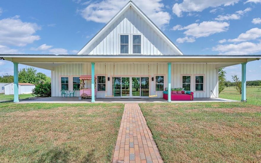 Casa Kumwesu — Waco's Ice Cream House....Welcome to this 3-bedroom, 2-bath home set on 5.32 acres of peaceful Texas countryside in Waco. Built in 2016, it blends modern comfort with serene surroundings, offering a private retreat with easy access to the best of Waco—including Magnolia Market, Baylor University, Lake Waco, local shopping, dining, and the nearby Deerfield Estates Venue, one of the area’s premier wedding destinations. Picture mornings with coffee on the front porch, quiet walks under oak trees, and evenings as the sun sets.
Inside, soaring ceilings and expansive windows create an airy, light-filled atmosphere. The open-concept design connects the living room, dining area, and kitchen, making it ideal for everyday living and entertaining. The kitchen features marble countertops, a farmhouse sink, stainless appliances, and an oversized island. A walk-through butler’s pantry with shelving and counter space connects to the laundry room, adding storage and convenience.  Furnishings Optional!!  
The split floor plan ensures privacy, with the primary suite set apart as a retreat. Here you’ll find his-and-hers closets and a spa-inspired bathroom with a deep soaking tub, dual vanities, and large windows. Two additional bedrooms and a full bath on the opposite side of the home provide space for family, guests, or a home office.
A striking spiral staircase leads to the loft, a versatile bonus area ideal for a media room, creative studio, or playroom. Outdoor living is equally inviting, with a welcoming front porch, covered back patio, and acreage dotted with mature oak trees—perfect for gardening, entertaining, or simply enjoying peaceful Texas evenings.
This property is being sold as-is and is currently operated as a short-term rental, giving buyers the option to continue as an income-producing Airbnb or transition it into their own residence!