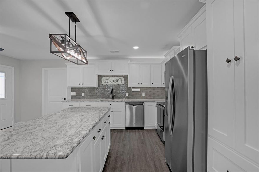 What a wonderful opportunity to own an almost-new custom home without the hassle of an HOA! Completed in 2022, this home looks and feels brand new. A charming front porch welcomes you inside to a cozy living room that seamlessly flows into the beautiful custom kitchen and dining area, creating an inviting space for everyday living and entertaining. You’ll love cooking in the thoughtfully designed kitchen featuring custom-built details such as soft-close drawers, a corner lazy Susan, pull-out trash drawer, under and above cabinet lighting, and a large granite island where everyone naturally gathers. The spacious primary bedroom offers a private ensuite bathroom and a large walk-in closet. Two additional bedrooms are thoughtfully separated from the primary suite for added privacy and functionality. All bedrooms and the living room are pre-wired for flat-screen TVs. Quality hardwood window trim and luxurious 2-inch blinds frame every window throughout the home. Step out to the side porch that leads to a generously sized yard extending into an L-shaped backyard, perfect for outdoor enjoyment. The home is also equipped with a Rain Bird foundation watering system surrounding the property to help protect your investment. Ideally located in the heart of downtown Blue Ridge with charming country-style shops nearby, while still offering quick access to Melissa Buc-ee’s, H-E-B, Walmart, and more! This home truly offers the best of small-town charm and modern convenience.