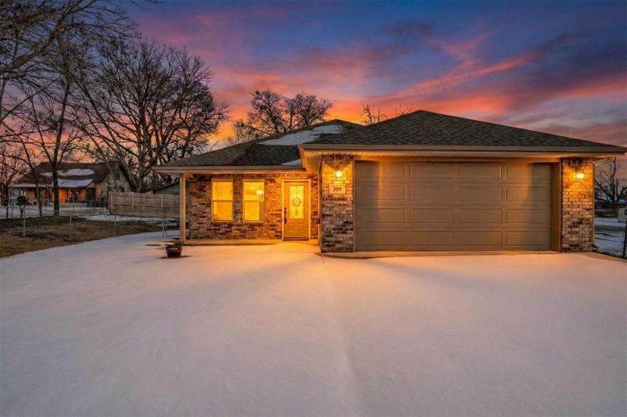 What a wonderful opportunity to own an almost-new custom home without the hassle of an HOA! Completed in 2022, this home looks and feels brand new. A charming front porch welcomes you inside to a cozy living room that seamlessly flows into the beautiful custom kitchen and dining area, creating an inviting space for everyday living and entertaining. You’ll love cooking in the thoughtfully designed kitchen featuring custom-built details such as soft-close drawers, a corner lazy Susan, pull-out trash drawer, under and above cabinet lighting, and a large granite island where everyone naturally gathers. The spacious primary bedroom offers a private ensuite bathroom and a large walk-in closet. Two additional bedrooms are thoughtfully separated from the primary suite for added privacy and functionality. All bedrooms and the living room are pre-wired for flat-screen TVs. Quality hardwood window trim and luxurious 2-inch blinds frame every window throughout the home. Step out to the side porch that leads to a generously sized yard extending into an L-shaped backyard, perfect for outdoor enjoyment. The home is also equipped with a Rain Bird foundation watering system surrounding the property to help protect your investment. Ideally located in the heart of downtown Blue Ridge with charming country-style shops nearby, while still offering quick access to Melissa Buc-ee’s, H-E-B, Walmart, and more! This home truly offers the best of small-town charm and modern convenience.