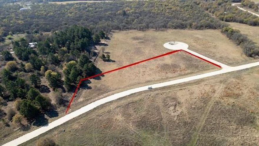 Tucked away in the peaceful countryside of Poolville, Texas, this stunning 2.02-acre homesite offers the perfect setting to build your dream home. Situated on a quiet cul-de-sac, the level lot makes building easy while showcasing beautiful pastoral views and a pine tree-lined backdrop that adds both charm and privacy. Located within the gated community of The Reserve at Shadle, this property offers a rare blend of tranquility and security. Enjoy the freedom to build on your timeline with no required start date, and bring your own builder to truly customize your vision. Residents appreciate the calm, private atmosphere where nature takes center stage and everyday noise fades away. Families will also benefit from the highly regarded Poolville ISD, known for its strong academic performance and high graduation rates—offering quality education while embracing the serenity of country living.
