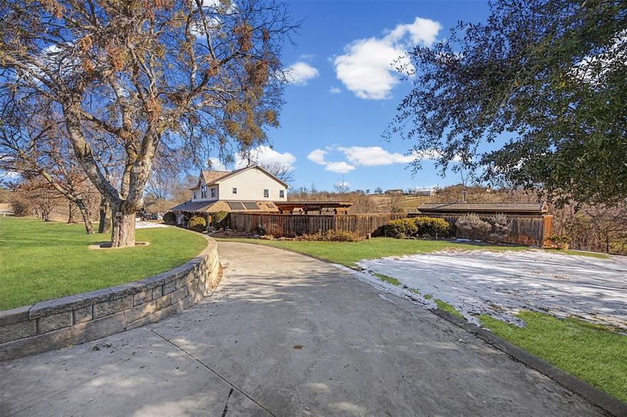Over 3 acres of everything imaginable! Pool, pond, space for animals, amazing shop, private well, guest quarters, all in the Aledo ISD! Built and cherished by a one owner family,this extraordinary property is more than a home—it’s a legacy. Rich in history and craftsmanship, this remarkable residence is a true testament to its architectural distinction and enduring quality.This stunning two-story home showcases breathtaking features throughout the interior, blending rustic elegance with timeless design.A wood-burning stove beautifully connects the kitchen and living room, creating warmth and ambiance at the heart of the home. The spacious primary suite upstairs offers a peaceful retreat complete with a private ensuite bath,while an optional SECONDARY primary suite on the main floor—also with a full ensuite bath—provides flexibility for guests or multi-generational living. Large windows throughout flood the home with natural light, highlighting the genuine craftsmanship. Step outside to your own private oasis featuring an outdoor pool surrounded by an expansive stone-laid patio. Two pergolas both enhance the outdoor living experience—one poolside and another on the back porch overlooking a serene seasonal pond.For all those who enjoy a shop that has it all-includes a large hand built wood stove and 4 mini splits keeping it nice and cool or warm for all seasons working on those projects.also entails a glassed porch area overlooking the property;Upstairs is a full guest quarters consisting of 2 bedrooms, a full bathroom, bath-shower combo;downstairs includes an additional full bath with shower, and full sized washer-dryer area. The second shop, another area with plenty of space to work on automobiles or projects,comes with plenty of storage. This property includes 3 large solar panels,totally paid for, that result in very attractive utility bills throughout the year. TThe list goes on and the features are endless in this home! Schedule your showing today!