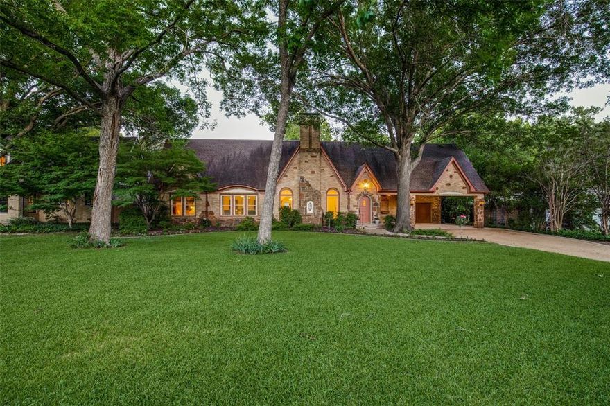 This timeless, understated Tudor unites 1937 charm (coved ceilings, original 1.5in hardwoods, beams, stained glass, arched entries, pitched roof) with today's lifestyle (open floor plan, entertainment kitchen, formals, a downstairs master retreat, oversized bedrooms, as well as versatile breakfast, game, media, and hobby rooms). Expansive remodel welcomes any size family - especially those that entertain. Extended sightlines draw you to the billiards room, covered loggia, sports court, volleyball-soccer field, dining arbor, and remarkable oversized diving pool with beach entry, spa, & sunken fireplace seating. Fun is endless in this estate-like backyard. Additional design innovations included sound deadening architecture, generous pass-through garage with front-rear alley access, & the potential of a 5th bed-bath & 2nd laundry in the 800+ sqft habitable attic space make this a home that must be experienced.