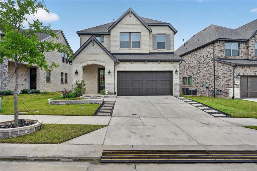 Welcome to this beautifully designed 2022 David Weekley home in the highly sought-after Parker Place community, where modern style meets everyday functionality. This spacious 4-bedroom, 3.5-bath residence features an open-concept layout filled with natural light, enhanced by upgraded luxury vinyl plank flooring that flows seamlessly throughout the main level and up the staircase. The heart of the home is a stunning kitchen showcasing quartz countertops, a large island, upgraded hardware, and abundant cabinetry—perfect for both entertaining and daily living. The main floor also includes a dedicated dining room, private office, and a convenient half bath. The primary suite offers a true retreat, complete with a sitting area and a spa-inspired bath featuring a garden tub, separate sunken shower, dual vanities, and a spacious walk-in closet. Upstairs, you’ll find well-appointed secondary bedrooms along with an oversized game room, ideal for relaxing or hosting guests. Thoughtful upgrades continue throughout, including custom tile work in the laundry and primary bath, decorative lighting, smart home features, and a solid wood garage door. The home is equipped with high-speed fiber internet, CAT6 wiring, and coaxial prewiring for seamless connectivity. Built with 2x6 exterior walls, the home offers enhanced insulation and improved energy efficiency.
Step outside to a low-maintenance backyard featuring turf and a covered patio—perfect for year-round enjoyment. As original owners, the sellers have meticulously maintained the home. Located within Lewisville ISD, with access to Hebron High School and the Technology, Exploration & Career Center East, and just minutes from shopping, dining, and major highways, this home offers the perfect blend of comfort, convenience, and elevated living. HOA amenities include landscaped open spaces, an entry feature, and a playground. Schedule your showing today!