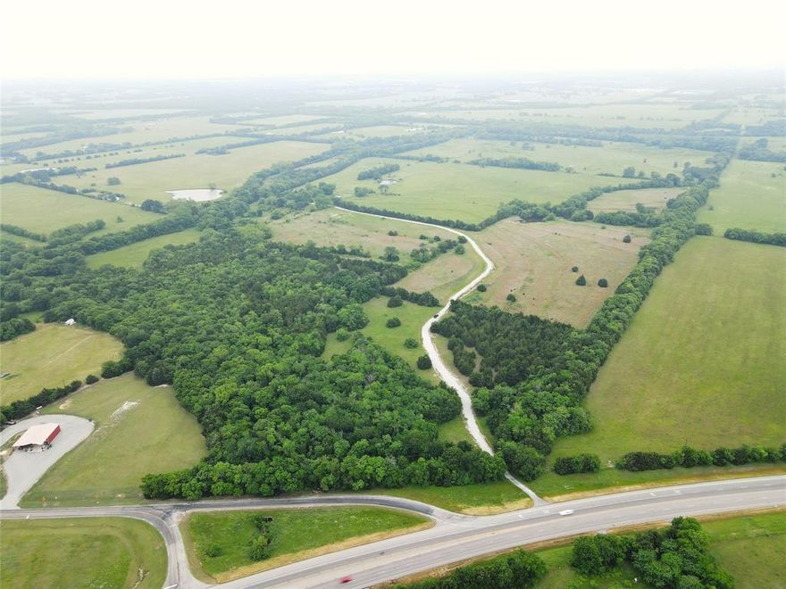 `63mi NE of Dallas, and 9 miles SW of Bonham, Shale Creek Ranch is a well located 125+- Acres with potential for many end uses. The topography on the ranch has a gentle roll, which provides both privacy and scenic views. The pastures are improved with Bahia and Bermuda Grass and are all suitable for baling hay or grazing livestock. The ranch also has three stock tanks, an unnamed limestone creek, and has been fenced. Wildlife is abundant with a strong population of white-tailed deer, hogs, and other animals living in the area. Shale Creek Ranch offers the marketplace an exceptional raw piece of land with development potential, and great proximity to both the DFW metroplex, and the future Bois D’Arc Lake. The ranch has approximately 45ft of Highway 121 frontage, approximately 500ft of Business Highway 121 frontage, a turn off lane from Highway 121, and approximately 2065ft of Fannin County Road 4645.  Electricity is provided by Fannin County Electric Coop, and water by SW Fannin SUD.