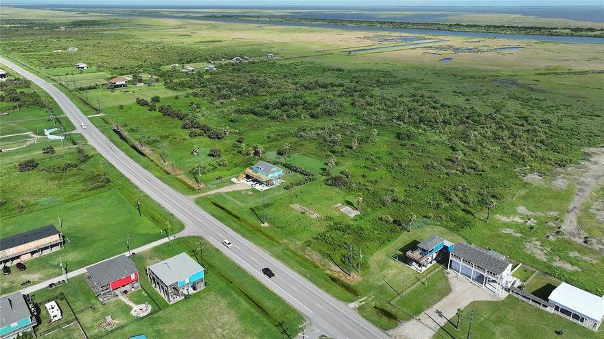 Exceptional 70.43-acre property offering a rare combination of high-visibility highway frontage and direct access to the Intracoastal Waterway, located along HWY 87 on the desirable Bolivar Peninsula. This expansive tract includes valuable acreage on Goat Island, offering unique possibilities for water-based development, recreation, or conservation.  Whether you’re considering a residential enclave, eco-tourism site, resort development, or private estate, this property checks all the boxes for location, access, and future potential. Don't miss this opportunity to own a versatile piece of Texas Gulf Coast real estate.
