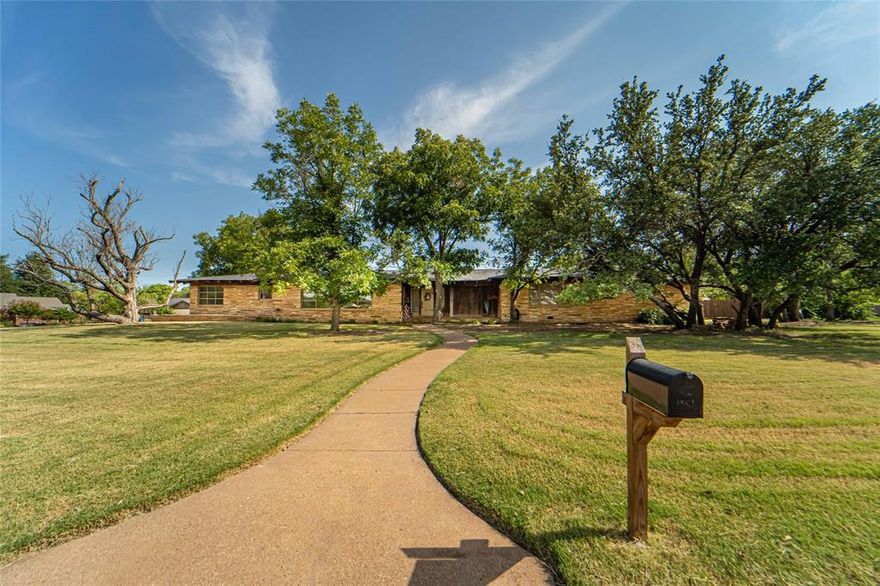 Spacious 4,260 sq ft ranch-style home featuring 4 bedrooms and 3.5 baths on a desirable corner lot. Stunning stone exterior adds timeless curb appeal. Walk into a gourmet kitchen with an island, granite countertops, farmhouse sink, and stainless-steel appliances. A separate pantry is located off next to the laundry room. Entertaining designed dining room lined with windows providing plenty of natural light which is perfect for all gatherings and company. The second living area is currently used as an office and workout room. Retreat to the expansive primary suite with walk in shower, double sinks and lots of closet space. Three additional bedrooms each have dedicated bathrooms, perfect for family or guests.  Enjoy outdoor living on the patio equipped with a lit-up gazebo or relax in the landscaped yard with plenty of space for a pool, play area, or garden. A separate outdoor room with a drain is located off the patio for gardening. Set on a serene corner lot with easy access to local shopping and schools, this ranch home offers both privacy and convenience. Don't pass up your chance to see this great property!