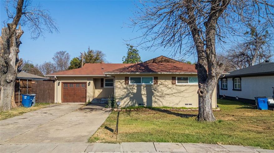 1950s traditional home offering 3 bedrooms, 2 baths, and a second living area in the established Walnut Hills neighborhood. Kitchen includes a gas range, built-in microwave, dishwasher, and two pantries, with an eat-in area. Floor plan features adjoining living and dining spaces plus a bonus family room with brick fireplace. Double atrium doors open to a covered patio and fenced backyard with an eight-foot privacy fence. Interior lot with mature trees, front-facing garage, and city utilities. Property is being sold as-is and presents an opportunity for updates and personal touches.Sold as is