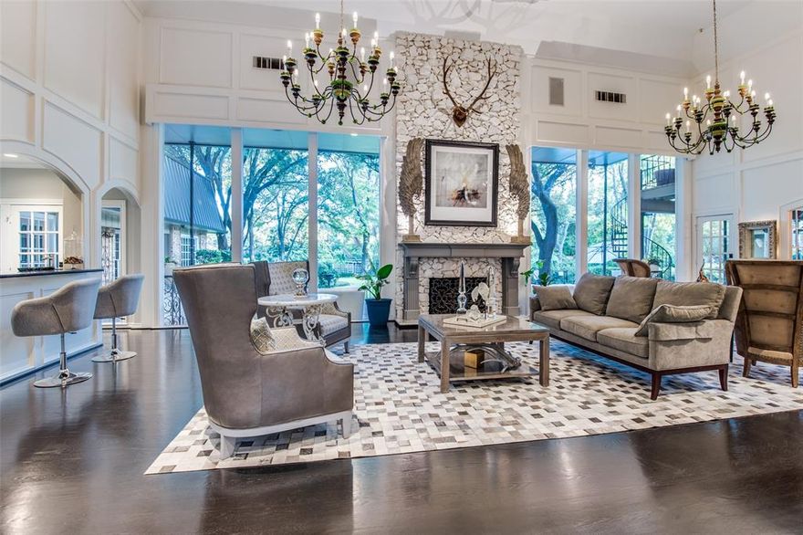 RARE, full acre with private lake frontage, this home provides a serene setting yet is minutes from Dallas’ best shopping & restaurants. Grand foyer with soaring ceilings leads to dramatic great room featuring floor to ceiling windows providing views of the expansive backyard, covered terrace, pool & play area. Extensively remodeled in 2015, the chef’s kitchen, wet bar, multiple large, open dining & living areas provide a fabulous entertaining flow. An office & downstairs primary suite, with a second study, dual baths, sauna, custom closets & coffee bar are in a private wing of the home. The second floor has 3 ensuite bedrooms, game room, media room with full bath, storage room. 3 car garage with epoxy floor.