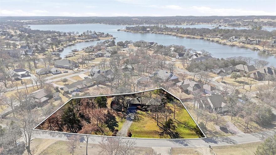 This charming 2-bedroom, 2-bath home is full of potential and ready for your personal touch. Whether you’re looking to renovate, refresh, or completely reimagine the space, the opportunities for customization are truly endless. With a flexible layout and solid footprint, this property is the perfect canvas to create a home that reflects your style and vision.

Situated on an incredible 2.5 lots totaling over 0.8 of an acre, the outdoor space is a rare find. The expansive yard offers room to garden, entertain, expand, or simply enjoy the privacy and shade provided by the many mature trees. A large outdoor storage building provides ample space for tools, hobbies, or equipment, while the carport adds convenient covered parking.