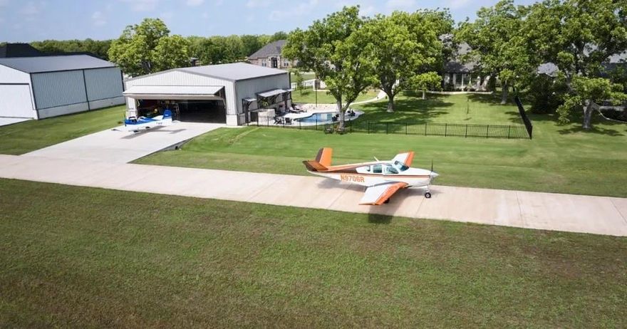 Located directly on the runway in the exclusive aviation community of Pecan Plantation.  This 1.4 acre lot offers a rare opportunity to build your dream home and hangar with direct runway access.  Ideal for pilots and aviation enthusiasts.  The property also presents a unique opportunity to purchase the adjacent lot (1507 Earhart) to create an oversized estate. Located within Pecan Plantation residents enjoy gated security, golf, tennis, clubhouse, marina, walking rails, and more. Don't miss the chance to create a one of a kind lifestyle in this premier airpark community.