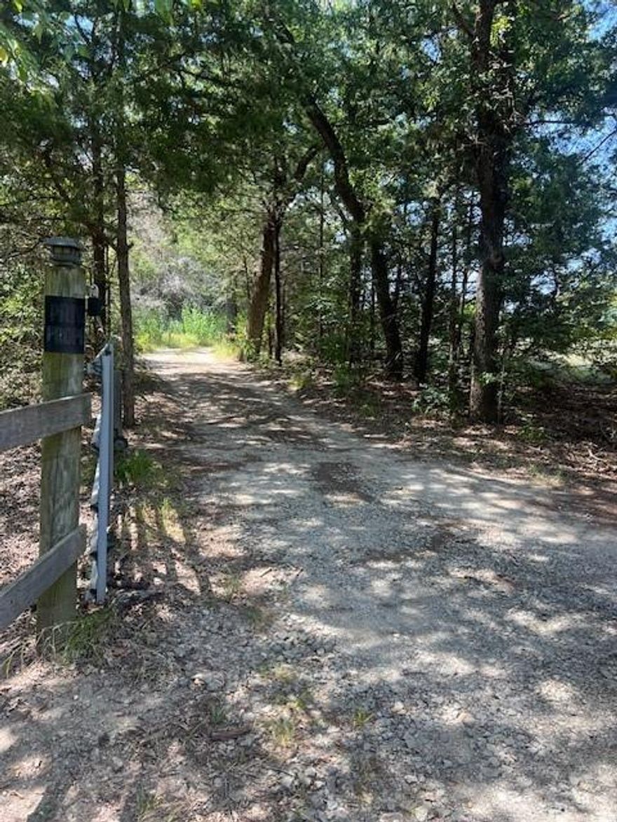 Beautiful and peaceful 30.376 acres located on County Road just minutes from town, offering both convenience and seclusion. As you enter the property, you are welcomed by a private drive that leads into a stunning wooded oasis filled with mature trees, open clearings, and the serene sounds of nature. This land is truly a retreat for anyone seeking a balance of privacy, beauty, and functionality.

The property is abundant with wildlife, making it a hunter’s paradise or a nature lover’s dream. Regular visitors include dove, quail, and deer, with the occasional hog passing through. With a wildlife exemption already in place, you will enjoy the benefit of lower property taxes while preserving the natural habitat that makes this land so special.

Included with the property is an older mobile home that will convey “as-is” and is currently occupied. This could serve as a temporary living space, a guest house, or even a potential rental opportunity while you design and build your dream home, ranch headquarters, or weekend retreat.

Another unique feature of this property is that it lies within an Opportunity Zone, offering potential tax incentives for investors and developers looking to maximize the land’s value. Whether you envision it as a private homestead, a recreational getaway, or a long-term investment, this tract offers endless possibilities.

Don’t miss the chance to own this remarkable piece of land with its combination of natural beauty, wildlife, and investment potential, all just a short drive from town. This is a rare opportunity to enjoy the peace and quiet of the countryside without sacrificing convenience.