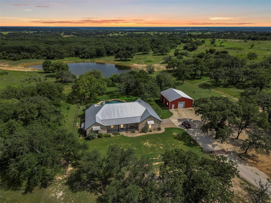 Located just outside of Granbury, TX this 128 acre ranch is a beautiful, secluded sanctuary.  The ranch includes a 2863 sq ft home, 1440 sq ft barn, and a swimming pool.  The property has a perfect mix of open pastures and wooded areas with live oaks, post oaks, red oaks, wild plum trees, redbuds, blackjack oaks, and native pecan trees.  5 beautiful ponds are scattered throughout the property that are stocked with bass, bluegill, and catfish.  The pond nearest the home was recently enlarged and a liner was installed to ensure plenty of water in dry seasons.  There is 80 feet of elevation change, and the home is tucked in a valley that provides complete privacy.  Wildlife seen on the property includes whitetail deer, doves, ducks, geese, wild turkeys, owls, bats, bobcats, foxes, coyotes, various birds, wild hogs, and other varmints.  Hike along the miles of cleared trails and pick wild blackberries, plums, grapes, and wildflowers.  The ranch backs up to a larger ranch and is protected from subdivision development.  All mineral rights are owned and will convey.  Come see it for yourself!

Distance to Granbury: 6 miles
Distance to Glen Rose: 8 miles
Distance to Lake Granbury: 4 miles
Distance to Squaw Creek Lake: 3 miles
Distance to Harbor Lakes Golf Course: 8 miles
Distance to Squaw Valley Golf Course: 9 miles