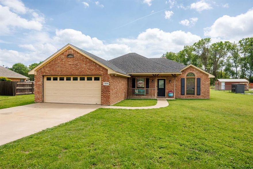 Seller is offering $5000 towards buyer closing costs and a Home Warranty. Rare opportunity to own this charming 3-bedroom, 2-bath residence set on just under half an acre, offering space, privacy, and freedom rarely found at this price point. Located in a quiet neighborhood tucked in close to the lake on the Fort Worth side of town with NO HOA. Freshly painted with updated flooring throughout, this home offers a welcoming and well-cared-for feel from the moment you step inside. The kitchen features granite countertops and is efficiently designed to flow into the main living area, where a cozy fireplace creates the perfect gathering space. Enjoy outdoor living with both a covered front porch and a covered back patio, ideal for relaxing or entertaining. Plenty of room to expand, garden, or create your ideal outdoor living space. RV hookup on the garage side of house. Neighborhood boat ramp close by for convenience of lake access without the cost of living on the lake. This is a wonderful place to put down roots and enjoy everyday living, both inside and out.
