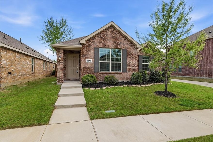 Welcome to 2376 Opaline Dr in Aubrey, Texas, where smart design, easy living, and newer construction come together in a way that simply feels comfortable from the moment you walk in. Built in 2020, this single-story home offers 3 bedrooms, 2 bathrooms, and approximately 1,400 square feet, but what stands out most is how well the space lives. The open-concept layout creates a natural flow between the kitchen, dining, and living areas, making the home feel connected, inviting, and larger than its footprint might suggest. It is the kind of floor plan that works well for everyday life, whether you are enjoying a quiet evening at home, hosting a few friends, or just wanting spaces that feel bright and easy to move through. The primary suite offers a comfortable retreat at the end of the day, and the large primary closet is a feature buyers will truly appreciate. It adds the kind of storage and functionality that makes daily living easier and gives the home an added sense of practicality. One of the most special features of this home is the way the outdoor space has been enhanced to feel like a true extension of the home itself. The expanded back patio creates more room to relax, gather, and enjoy the outdoors, giving you extra living space beyond the interior walls. It is easy to imagine morning coffee outside, casual dinners on the patio, or simply enjoying a slower pace at the end of the day. Located in fast-growing Aubrey, this home offers the appeal of a newer construction home with the convenience of single-story living, easy maintenance, and an approachable price point. For buyers searching for a move-in ready home in Aubrey TX 76227, a one-story home with open-concept living, or a newer home that offers smart value,  2376 Opaline Dr is a standout opportunity and offers the balance so many buyers are looking for: modern comfort, manageable upkeep, a setting in one of North DFW’s growing communities.