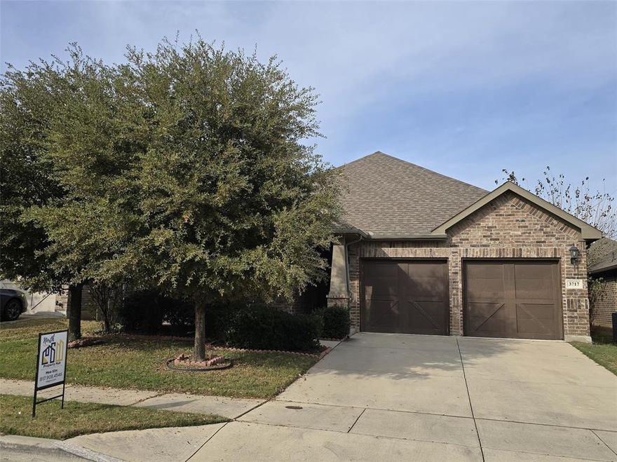 Charming 4 bedroom home is truly move-in ready! It's within walking distance of Keller ISD elementary, middle, and high schools, and offers quick access to I-35, 820, and 170. Just minutes from Alliance and Presidio shops and restaurants.

Inside, wood-look plank tile extends from the entry through the living, dining, and kitchen areas, creating a seamless open-concept layout. The kitchen is full of character, featuring white cabinets, a subway tile backsplash, and plenty of cabinet and counter space. A large utility room and pantry add extra convenience.

All lighting fixtures and ceiling fans have been upgraded. The home also includes a full irrigation system. Enjoy a cozy front porch and an oversized back porch measuring 7' x 30'—perfect for relaxing or entertaining.