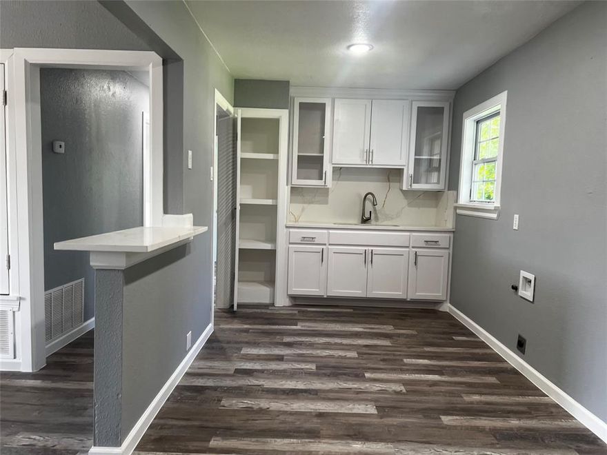 Beautiful house recently remodeled with new kitchen, fresh paint inside and outside the property, new flooring, light fixtures and ceiling fans and new siding. Central Heat and Air! Huge yard and access to park your car in the backyard of the house!! this house is 3 bedrooms, 1 bathroom and 1 car garage with fresh paint too!  ample laundry room!! come and see it now!