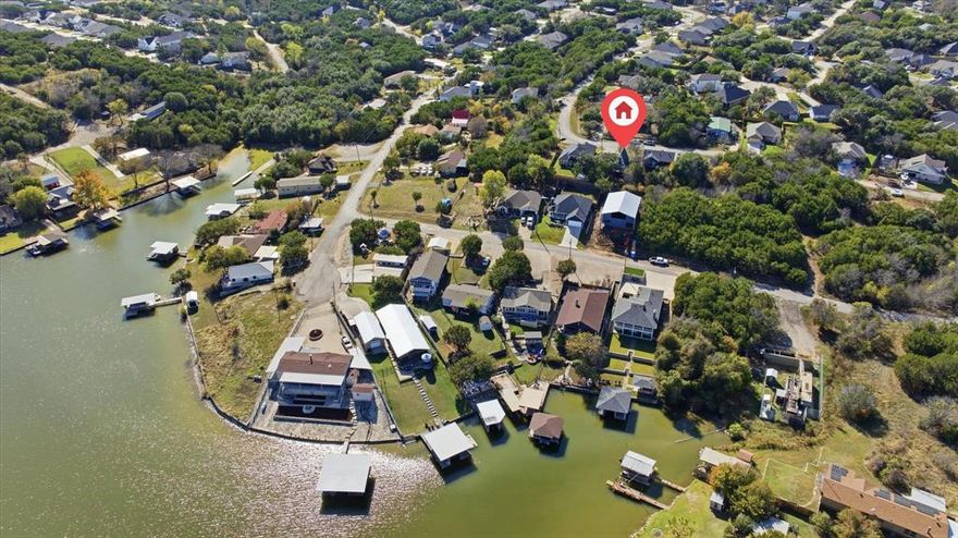 *MOTIVATED SELLER*Your dream lake-house retreat awaits on highly desired Lake Granbury. Welcome to 2707 Austin Dr, a beautifully updated A-frame home tucked inside the secure gated community of Canyon Creek. Filled with warmth, character and natural light, this home blends modern style with the cozy feel of classic lake living.
This charming 2 bedroom, 2 bath floor plan also features an upstairs bonus room that easily functions as a 3rd bedroom, game room or guest suite. The open living space showcases tasteful finishes and soft, inviting colors, creating a peaceful atmosphere from the moment you step inside. The adorable lake-inspired kitchen features an island, stainless steel appliances and everything needed to make hosting effortless — and the refrigerator conveys.
Take in the breathtaking lake views from the private upstairs balcony, sip coffee on the welcoming covered front porch, or bring your boat and toys — the oversized driveway provides plenty of room for parking and storage.
This home has been thoughtfully updated with fresh interior and exterior paint, laminate and tile flooring and modern fixtures, making it move-in ready for full-time living or weekend escapes.
Located in one of Granbury’s most loved gated communities, Canyon Creek offers true resort-style amenities including:
big pool and small pool, basketball court, tennis courts, multiple parks and playgrounds, community fishing dock and boat docks, ramps and clubhouse and 24-7 gated security.
Residents rave about the peaceful setting, wonderful neighbors and relaxed lifestyle.
Whether you're looking for a serene full-time residence, a lock-and-leave weekend getaway or an affordable lake-house investment, this home delivers the Granbury lifestyle so many dream of and rarely find at this price point. Come experience it for yourself and see why everyone loves Granbury.