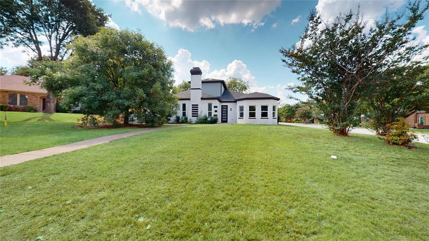 Nestled on a premium corner lot in a serene, established neighborhood. This 3,563 sq. ft. home has been masterfully reconstructed to offer the pinnacle of modern luxury. With every detail above the slab brand new, this home presents a rare opportunity to own a virtually new construction with timeless brick charm. The sprawling ranch style layout features four bedrooms, three designer bathrooms, two distinct living areas, & a sun room providing exceptional space for both relaxation and grand-scale entertaining. From the moment you enter through the 8-foot contemporary front door, you'll be captivated by a sun-drenched, open-concept floor plan with soaring 10-foot ceilings throughout and an integrated sunroom flood the home with natural light. The living area, complete with a modern fireplace and designer fixtures with coffered ceiling, is crafted for effortless entertaining. The gourmet kitchen is a showpiece of style and function, boasting a jumbo waterfall island, premium stainless-steel appliances, and sleek, custom all plywood cabinetry. The adjoining living space is anchored by a modern fireplace and accented with luxury flooring and stylish lighting throughout. Retreat to the opulent master suite, a private sanctuary complete with separate his-and-her closets and a spa-like ensuite bath. Indulge in the oversized jacuzzi tub, dual vanities, and exquisite European-style tilework. Outside, the huge L-shaped backyard offers a private oasis, featuring mature trees and large open area. An oversized garage and elegant crescent driveway complete this exceptional property. This is more than a home—it's a lifestyle, offering incredible value and sophisticated living at the right time.