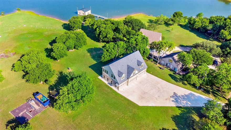 Offering 4.5 ACRES of GORGEOUS LAKEFRONT Property complete w Main House, Guest house & 3 Unit Apartment building which currently nets over $75K per year! Currently installing 3 New Roofs & Siding due to recent storm. HVAC in Main House replaced Dec 23. Nestled in the Cove at Oak Point,on Lake Lewisville, in Little Elm at the Peninsula. No HOA or Deed Restrictions is a bonus and you have more space to play and build on. The Property boasts a 3 Bed 2 Bath Main House with over 2,000 sq ft. Enjoy great views of the Lake from every angle. Separate Guest Hse with 2 Apartments & 4 car Garage, plus a 3 Apartment Unit built in 2022. 1 Bd 1 Bth w Kitchen & Living Room* 700 sq ft complete. Building has 5 Bay Garage *10ft High Doors* partially climate controlled w Storage Closet for Each Unit & a shared Laundry. 2 Slip Boathouse w Active Permit. This is what you have been looking for! Enjoy Beautiful Sunrise & Sunsets along with Fishing, Swimming & a relaxed Lake lifestyle year round,