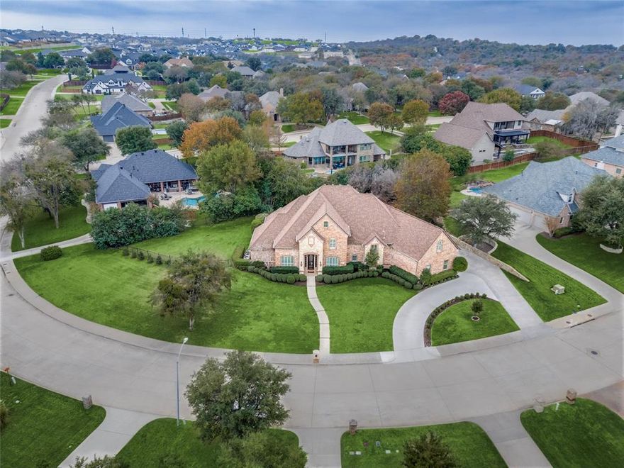 Experience lake living without sacrificing everyday comfort in this Ambiance custom home in the gated Waterfront Addition at Eagle Mountain Lake. Set on a beautifully landscaped lot with a sparkling pool, this residence is designed for people who love to gather, relax, and host. 

Inside, three generous living areas give everyone a place to land. The main family room looks out over the pool, while a separate sitting area and an upstairs loft with a kitchenette create perfect spots for movie nights, game days, or long weekend guests. The oversized multipurpose room, over 500 square feet, can serve as a game room, bunk room, home gym, or all of the above. Back stairs connect directly to the loft and multipurpose room, keeping the upstairs space feeling like its own retreat.

The kitchen is ready for serious cooking and casual nights in, with a commercial style range, space for a double refrigerator, and a huge walk in pantry to keep everything organized. Just off the pool, a convenient downstairs bath opens to the patio so guests can dry off and change without walking through the house.

Tucked on the main level, the primary suite feels like a private spa with a soaking tub, expansive double shower, bidet, and a dedicated vanity for getting ready. With two bedrooms down and two up, the layout works beautifully for multigenerational living, teens, or extended stays.

Recent updates, including a new tankless water heater, fresh interior paint, new carpet, and refreshed landscaping, let you move in and start enjoying the home right away.

Located just moments from Eagle Mountain Lake, residents enjoy the option to join Lake Country Property Owners Association, with private access to the boat launch, parks, greenbelts, and tennis courts. This is more than a house; it is a lakeside lifestyle with room for everyone and a backyard built for making memories.