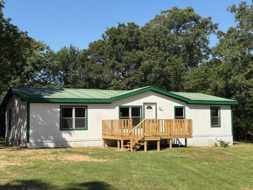 Charming 3 bedroom home on a one-acre lot near Lake Tawakoni State Park. Enjoy peaceful country living combined with convenient access to Tyler and Dallas. This completely renovated 3-2 double-wide mobile home sits on a spacious tree-filled lot, offering the perfect blend of comfort, privacy and outdoor adventure. Open layout is ideal for everyday living or weekend getaways. Perfect for full-time residence, vacation home or income-producing rental. Freshly painted, all new fixtures, appliances, flooring, windows, deck and septic. Whether you're relaxing at home, enjoying the nearby park or boating on the lake, this property has everything you need to embrace the Lake Tawakoni lifestyle!