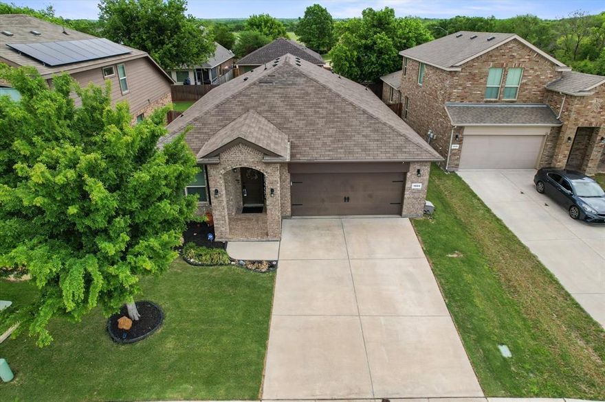 Tucked away at the end of a quiet cul-de-sac and surrounded by peaceful green pastures, this Burleson beauty offers the perfect blend of comfort, flexibility, and country-city living. With three bedrooms plus a dedicated study, this home adapts effortlessly to your lifestyle—whether you need a home office, second living area, or fitness space. Warm engineered hardwood floors welcome you at the entry and continue through the study, kitchen, and family room, creating a cohesive and inviting feel. Neutral tones throughout provide the ideal backdrop for your personal style. The heart of the home is the kitchen, featuring a large island, abundant storage, and a walk-in pantry—perfect for both everyday living and entertaining. Natural light pours in through the back windows, highlighting the cozy family room and drawing your eye to the tranquil outdoor setting. The split-bedroom layout offers privacy, with the spacious primary suite tucked away at the rear of the home. Here, you’ll find a relaxing retreat complete with dual sinks, a garden tub, separate shower, and a large walk-in closet. Secondary bedrooms are positioned in their own hallway near a full bath, creating a functional layout for family or guests. At the front of the home, the versatile study provides endless possibilities to suit your needs. Currently it’s used as a fitness space. Step outside to the extended, covered back patio—an ideal space for entertaining or simply unwinding at the end of the day. In the mornings, enjoy watching cattle graze nearby from the front yard, a charming touch that makes this setting truly special. Conveniently located near I-35 for easy commuting, yet far enough away to maintain a quiet atmosphere, this home offers the best of both worlds. Just minutes from local shopping, dining, and everyday conveniences—including H-E-B—this location checks every box.