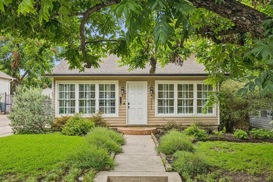 Charming 1940s Neo-Classical home in the heart of Hollywood Santa Monica! Designated by the Hollywood Santa Monica Historical Conservation District, this single-family gem offers timeless character paired with everyday comfort.

Inside, arched doorways and original hardwood floors create a warm, inviting flow. The spacious family room, anchored by a wood-burning fireplace with its original 1940s mantle and hand-painted tile, opens seamlessly to the dining room and kitchen. The enclosed, air-conditioned sunroom offers flexible space with views of the vibrant neighborhood—ideal as a home office, playroom, or cozy reading nook.

Step outside to discover an amazing backyard retreat. A large deck is perfect for summer barbecues, while the oversized yard—complete with towering trees and an 8-foot privacy fence—offers room for a pool, garden, or even home expansion. A detached 2-car garage and a quaint, powered storage shed add function to the charm.  City approved architecture plans, available by request, to add a 2nd level primary suite and 1st level remodel-renovation, to maximize the beauty of the home.

Nestled just steps from Lindsley Park and zoned to highly acclaimed Lakewood Elementary, this home places you in one of East Dallas’ most sought-after neighborhoods. Hollywood Santa Monica is celebrated for its historic beauty, active community events, and unbeatable location—minutes to White Rock Lake, the Arboretum, Lakewood Country Club, and downtown Dallas.

This delightful home blends history, flexibility, and neighborhood spirit—ready to welcome you home.