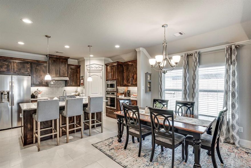 Welcome home to 539 Windrow!!  Step inside to this open concept home with gorgeous hard wood flooring, granite throughout the eat-in kitchen, a cozy fireplace in the living area with plenty of room to entertain.  Over-sized primary bedroom located at back of the home lends privacy and luxury with the suite bath.  2 other bedrooms at front of the house can be used for guests or an office space.  Finish your tour in the beautifully landscaped backyard complete with a wood privacy fence and a cozy porch to enjoy slow mornings or sunsets.  Bring your buyers by today!