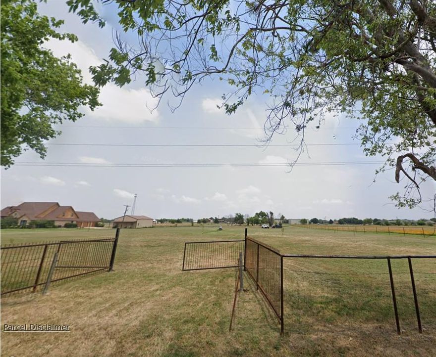 Nearly 5 acres of fully fenced land with a small pond.    A must see of prime real estate.  Offering approximately 500 feet of frontage ( 250 at the front and 250 feet at the, per survey).  Endless potential for building, recreation, or investment.