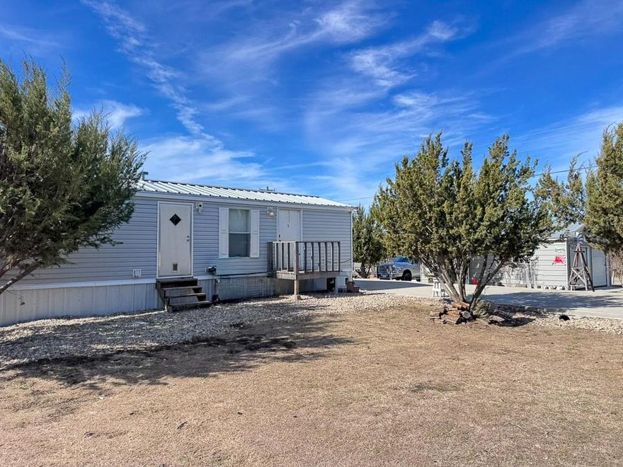 Escape to the quiet outskirts of Stephenville, the Cowboy Capital of the World, with this versatile 1-acre gem. Located on a peaceful private road, this property offers the perfect blend of move-in-ready comfort and future potential.

The heart of the property features a cozy, 640 sq ft, 1-bedroom, 1-bathroom single-wide home, highlighted by a front porch—the ideal spot for morning coffee or watching the Texas sunset. A clean, professional 80x20 concrete drive leads you to the standout feature: a 20x25 detached 2-car garage and shop. Fully equipped with electricity, this space is a dream for hobbyists, mechanics, or anyone needing secure storage for their gear and toys. You will also find 2 RV hookups on the property.

With a full acre at your disposal, you have the freedom to expand. Whether you’re looking to build your forever home later, start a garden, or simply enjoy the elbow room, this property is a blank canvas.