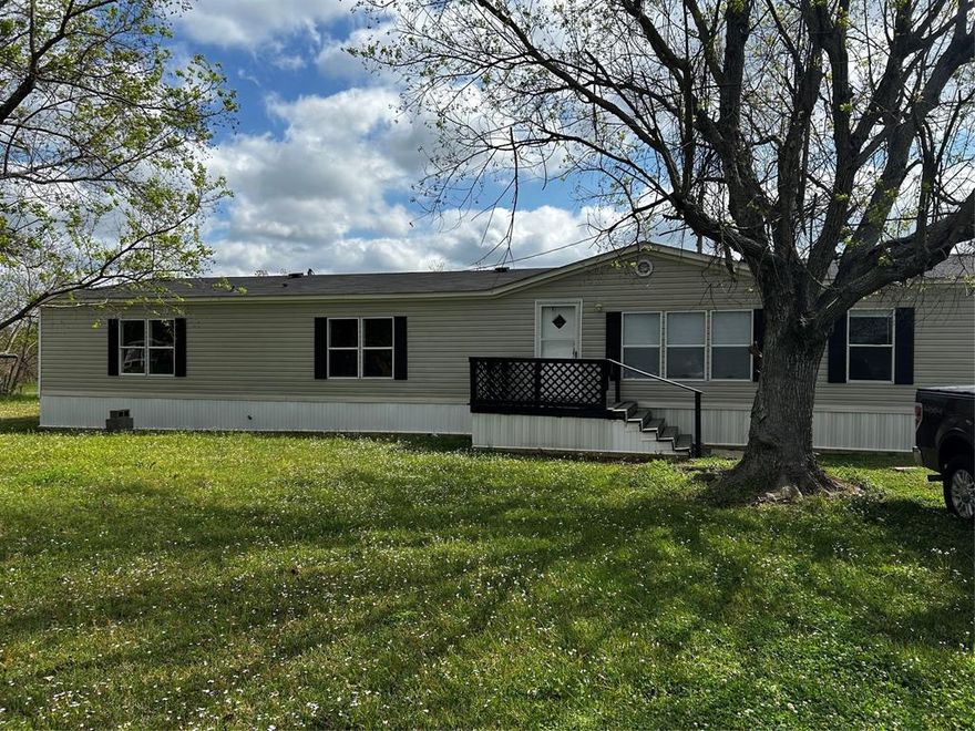 Updated with new flooring,updated counters in kitchen and bath. SUPER OPEN FLOOR PLAN. HUGE DEN with fireplace. Remote master with attached master bath with garden tub and walk in shower plug giant walk in closet. Island in kitchen. Other 3 bedrooms are large and 2 have walk in closets. Lg covered back deck. Fully fenced corner lot.  
Sits on corner of Meadow Dr. just north of Kickapoo Corner and Pecan Dr.   RETROFIT and new skirting are done. Ready to go new FHA or VA loan for qualified buyer
Down payment assistance for qualified buyers. .
Updated electric system 2023 and new central air 2023