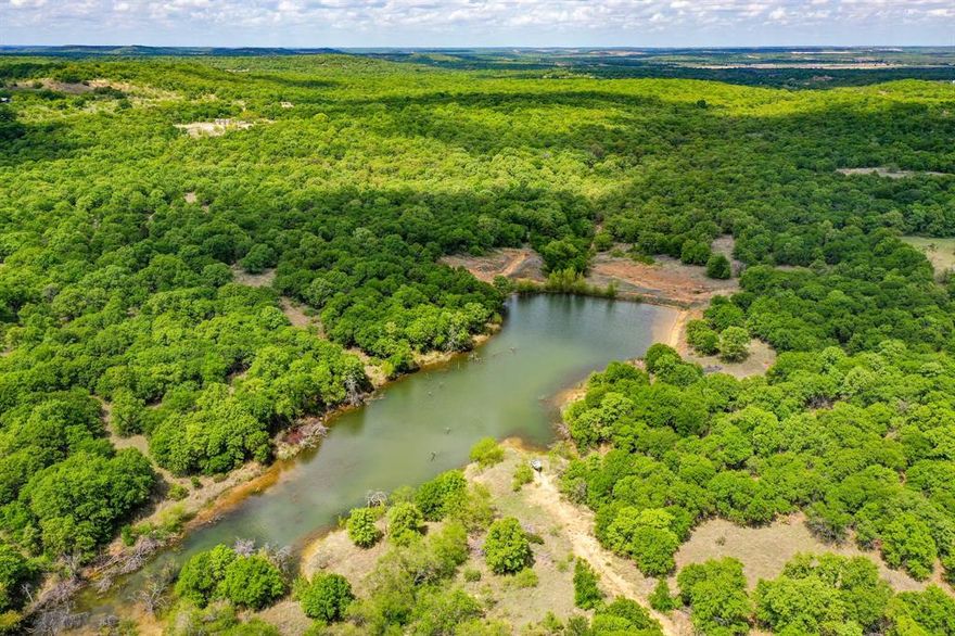 tunning and rugged 240 acres on Battle Mountain just north of Jacksboro, TX. This property has scenic views to the north, west and south due to the orientation of the property as it saddles Battle Mountain on both side. The property has electricity. The property has 4 stock tanks with the largest being close to 2 acres. The property is mostly covered with post oaks. There is a previously cultivated field at the center of the property. Excellent hunting and fishing.  Ag Exempt. Working pens.
Easements. The property is accessed from a quarter-mile easement off Middlebrooks Lane. There are also two access easements running on the north part of the 240 acres used by two neighbors to the west. 
Oil and Gas. There are two pump jacks located next to each other on the west side of the property. The oil and gas lease is accessed from the west side of the property.
Shown by appointment only.
If cooperating broker-agent is not present during initial contact, showing(s), and-or negotiations, cooperating broker-agent will not be entitled to full cooperating fee, with the cooperating fee being at the sole discretion of Maddox Realty