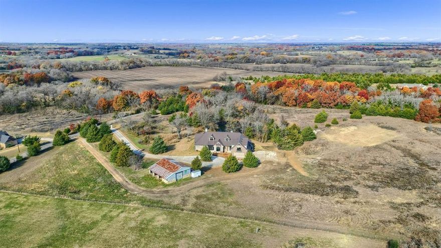 This is a one of a kind custom designed home with a private setting and amenities that are often sought after, but rarely found available for sale together. This home is well appointed with quality materials such as Pella windows and doors, Volterra beams, natural stone interior accents, metal roofing, custom selected plumbing and electrical fixtures, designer tile floors and walls, electric patio shades, and true masonry fireplaces just to name a few. In addition, the home also has a strong focus on security, safety and comfort during the hardest weather Texas can throw at you, with
a 304 SQFT Basement Storm Celler with access to the interior and exterior of the home. In addition, the home is also equipped with a whole house 26kw Generac propane fed generator. Outside the home are mature oak, pecan and cedar trees sprinkled on the property and around a 9’ deep fishing pond, all just a few steps from the rear patio.